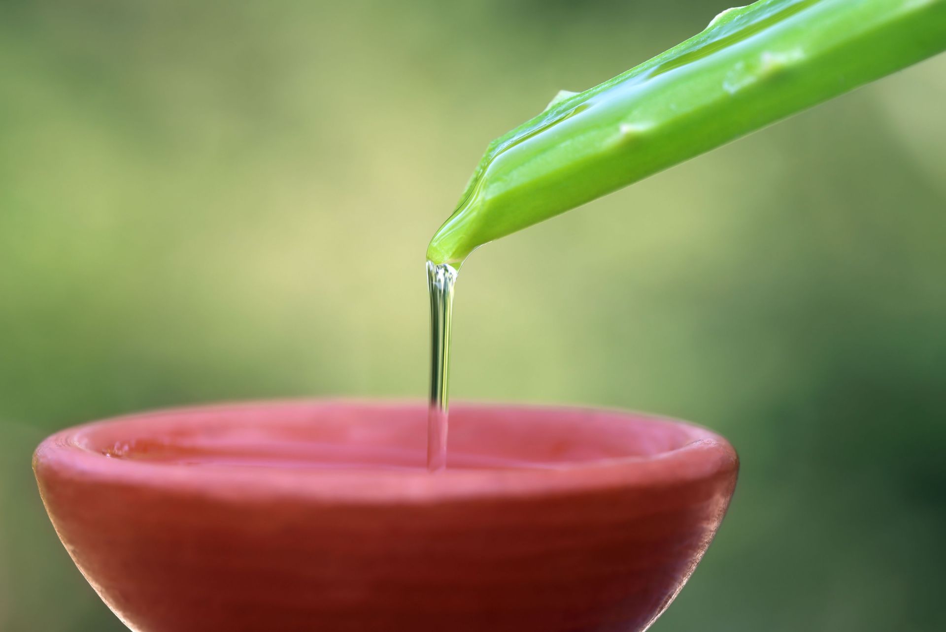 close-up-shot-of-aloe-vera-extract-poured-into-a-b-2023-07-14-06-18-29-utc